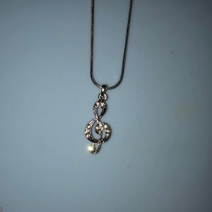 Treble clef necklace